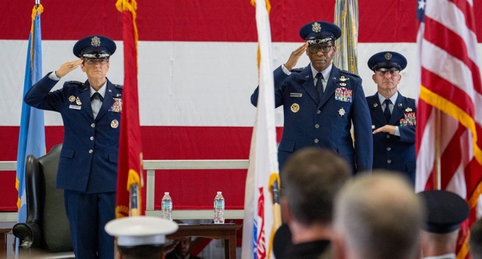 Gen. Randall Reed, the new U.S. Transportation Command commander, and Gen. Jacqueline Van Ovost, outgoing USTRANSCOM commander, salute the colors during his change of command ceremony at Scott Air Force Base, IL. During the ceremony, Air Force Gen. Randall Reed assumed command from Air Force Gen. Jacqueline Van Ovost, who retired with 36 years of service in the Air Force.