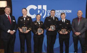 Four students from the U.S. Merchant Marine Academy were awarded the Thomas B. Crowley Sr. Memorial Scholarships last year. From left: John Berry, Crowley Wind Services; USMMA cadets Elizabeth Kay, Gianna Russo, Draygan Colonese and Charles Lausten; Joe St. Pierre, Crowley Wind Services.